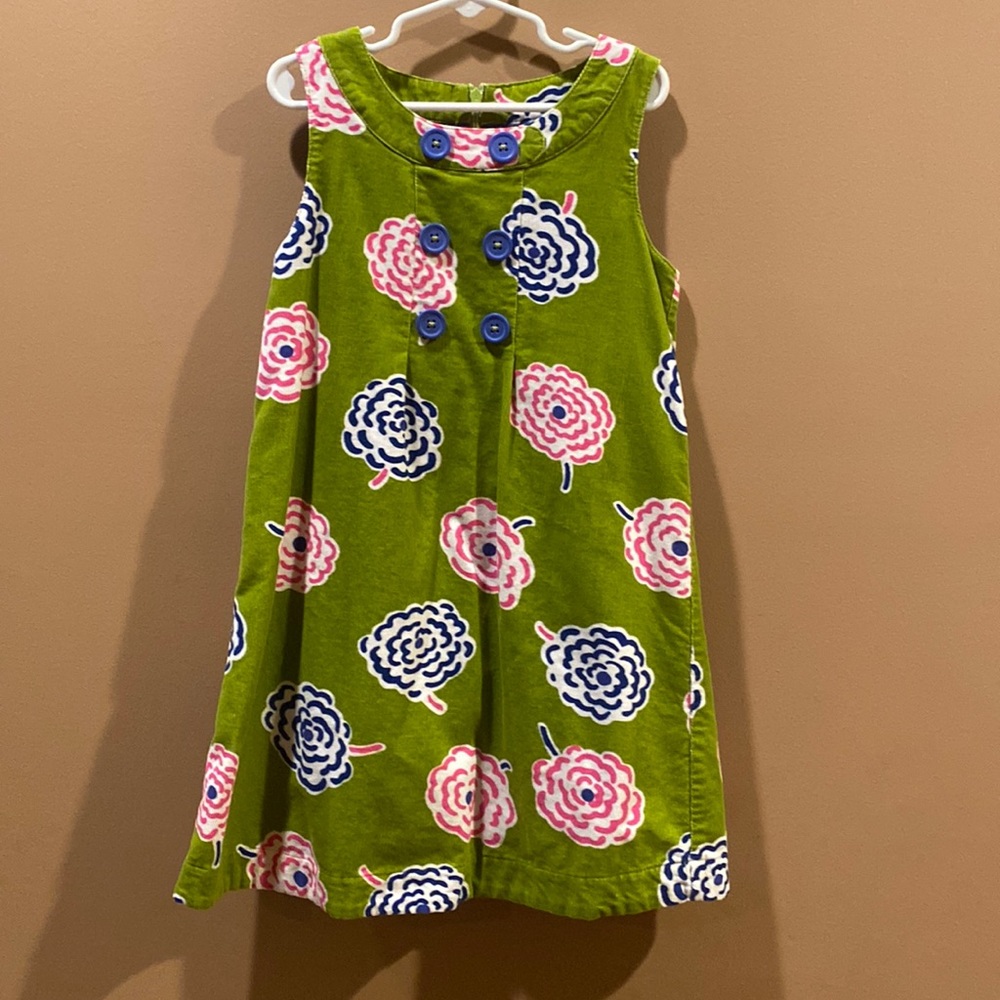 Mini Boden green corduroy dress with pink and blue flowers.  Girls size 7/8